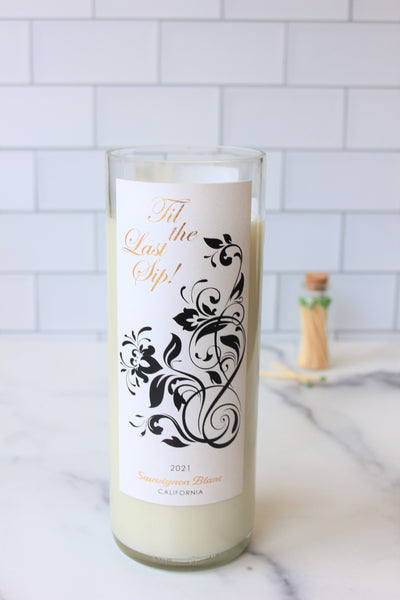 Santal + Coconut scented soy candle handmade in a repurposed wine bottle