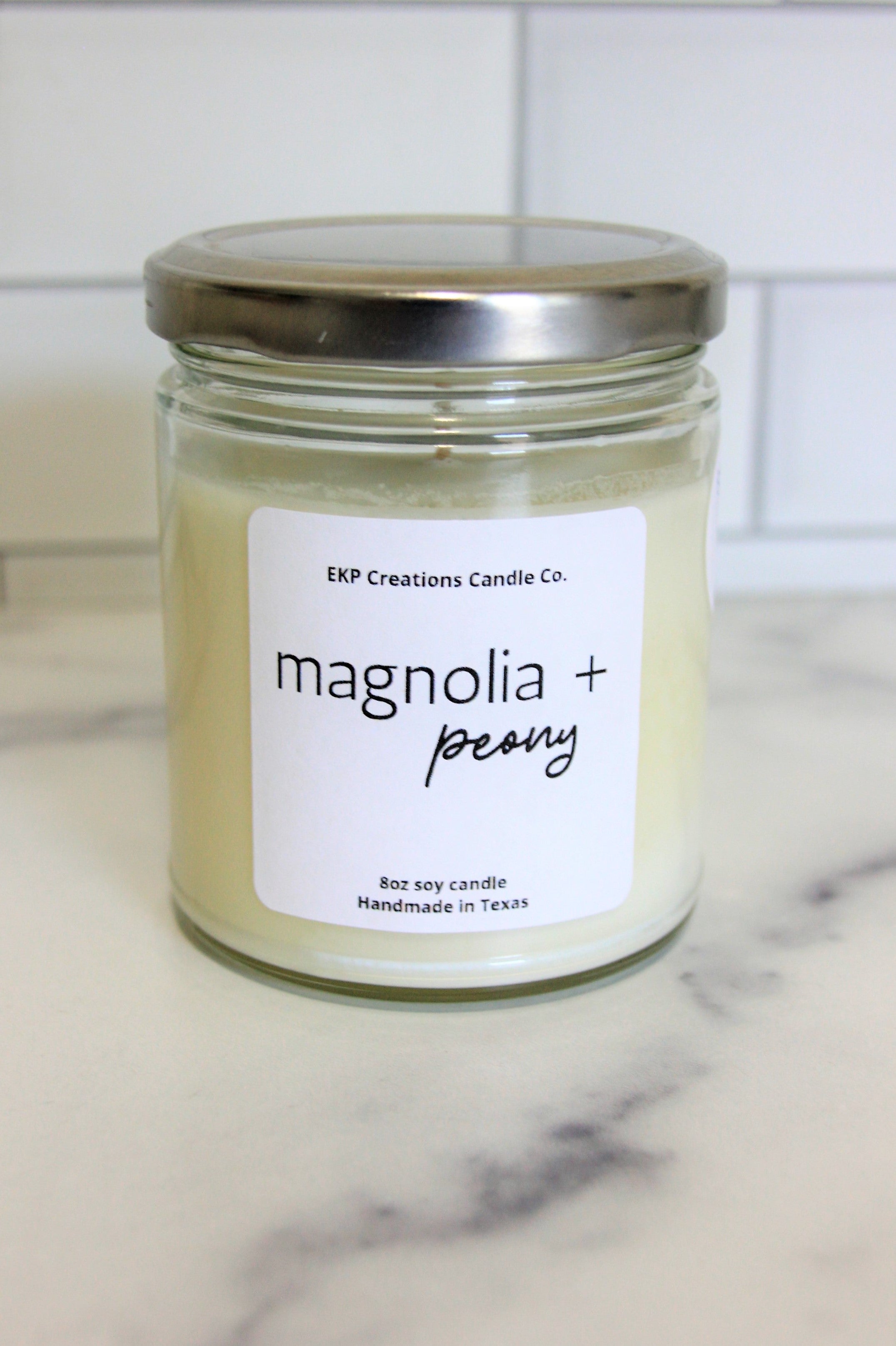 Magnolia + Peony scented 8oz soy candle handmade in Plano, Texas