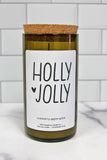 Holly Jolly soy candle in a repurposed wine bottle